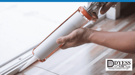 Image of a caulking tool being used to insulate a window