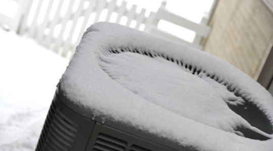 HVAC covered in snow
