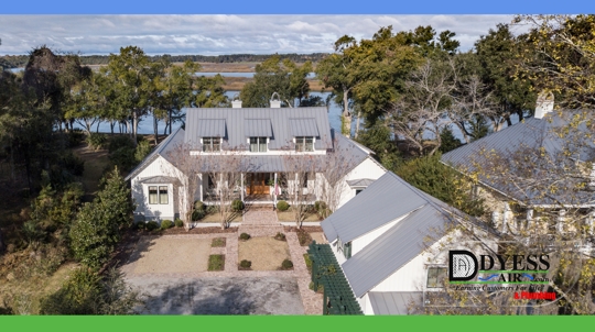 A charming Lowcountry home surrounded by coastal scenery, showcasing the importance of HVAC and plumbing protection from salt air corrosion