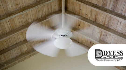 Ceiling fan spinning in home.